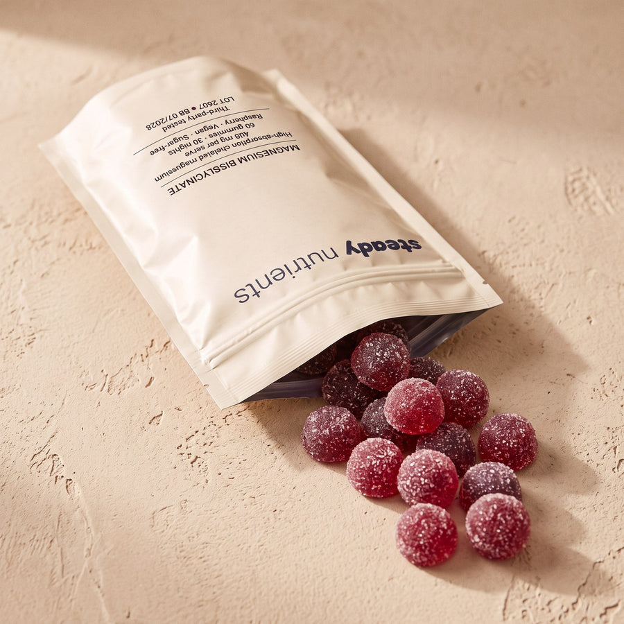 A flat lay of the Steady pouch with loose raspberry gummies